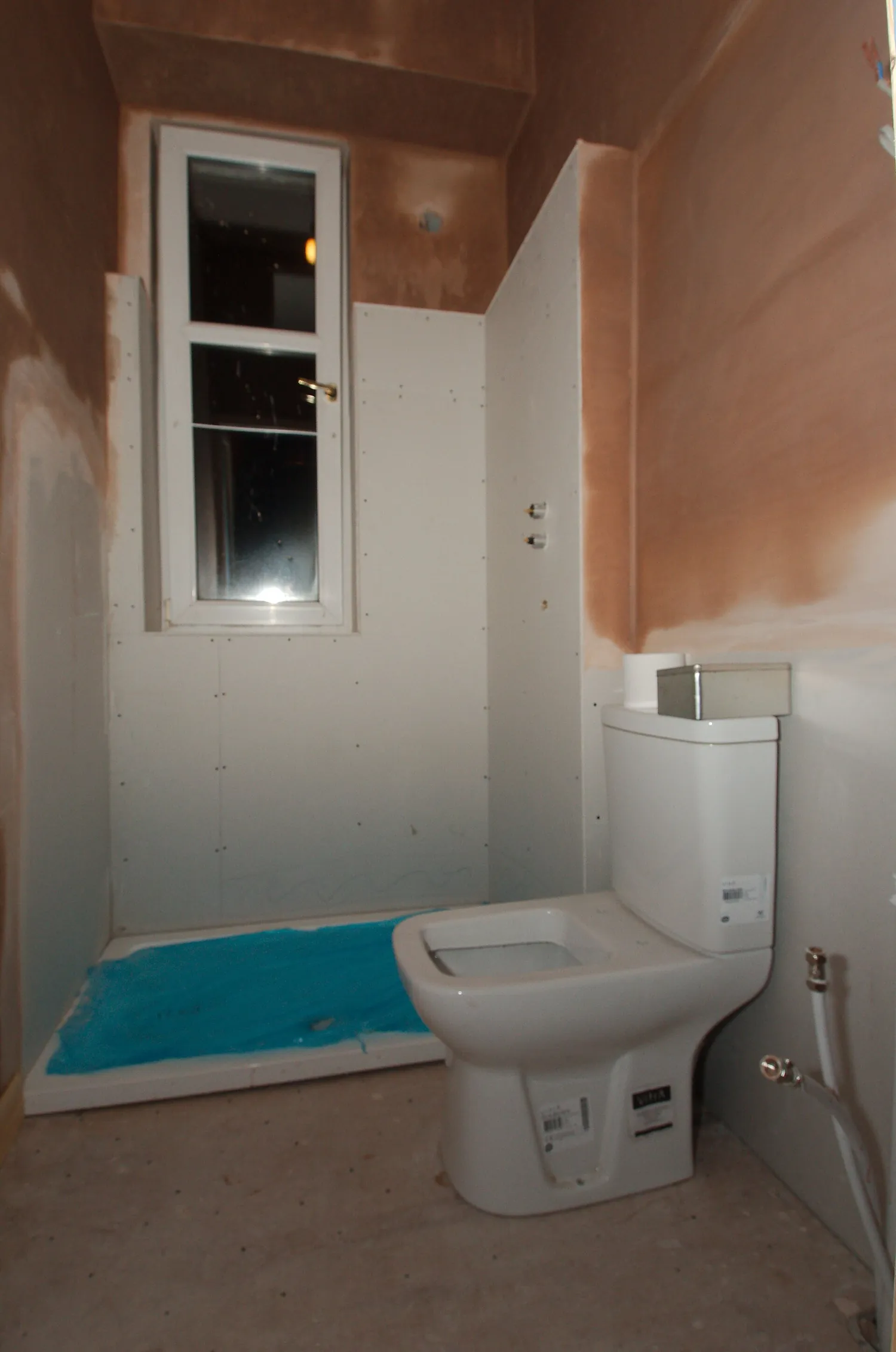 Couple finishing their DIY bathroom with reglazed tub