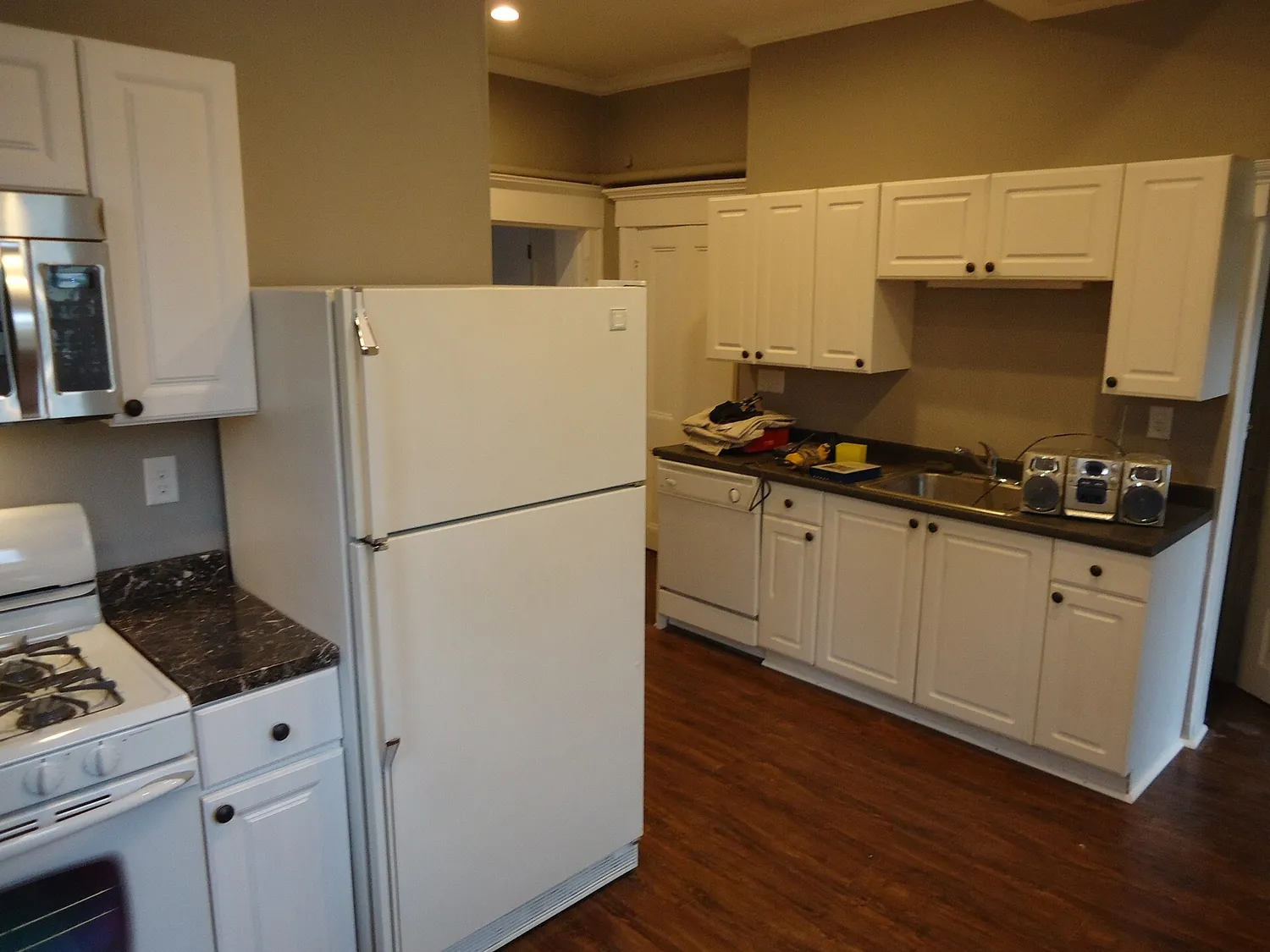 Owner showing off a finished century home kitchen project